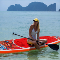 Thumbnail for An woman sitting on a Funwater Feath-R-Lite Koi 11' Inflatable Paddle Board SUP